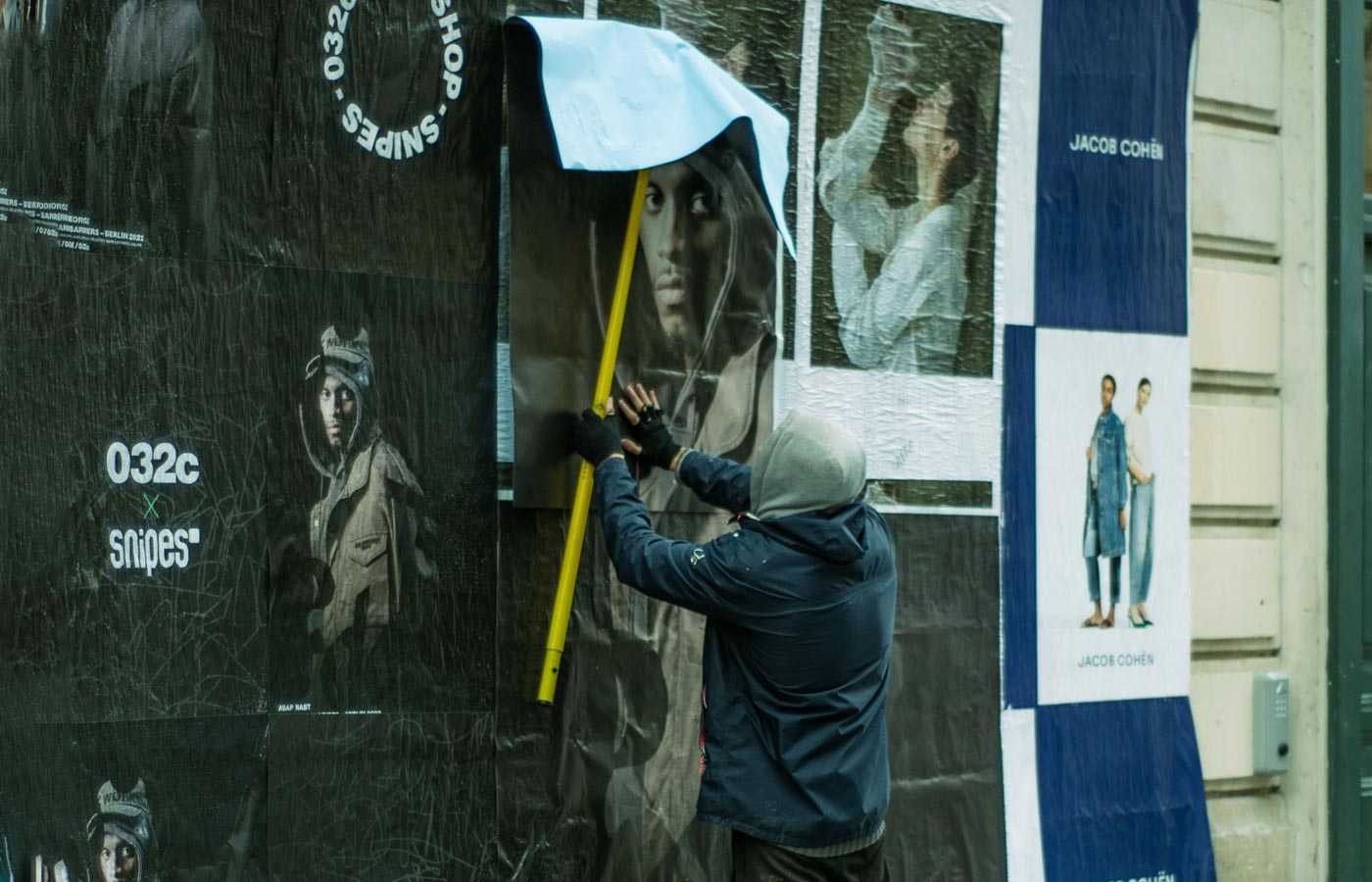 Wheatpaste poster installation by street teams in New Jersey